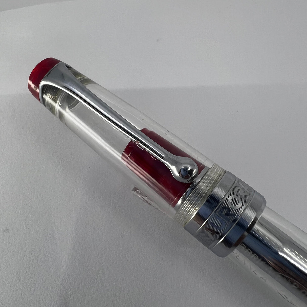 Aurora Optima Transparent Demonstrator Limited Edition Rollerball with Red Auroroloid Highlights