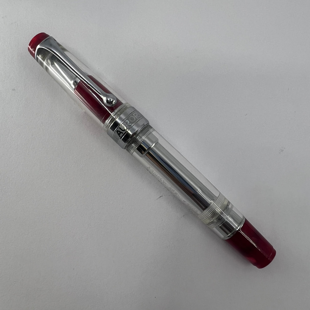 Aurora Optima Transparent Demonstrator Limited Edition Rollerball with Red Auroroloid Highlights