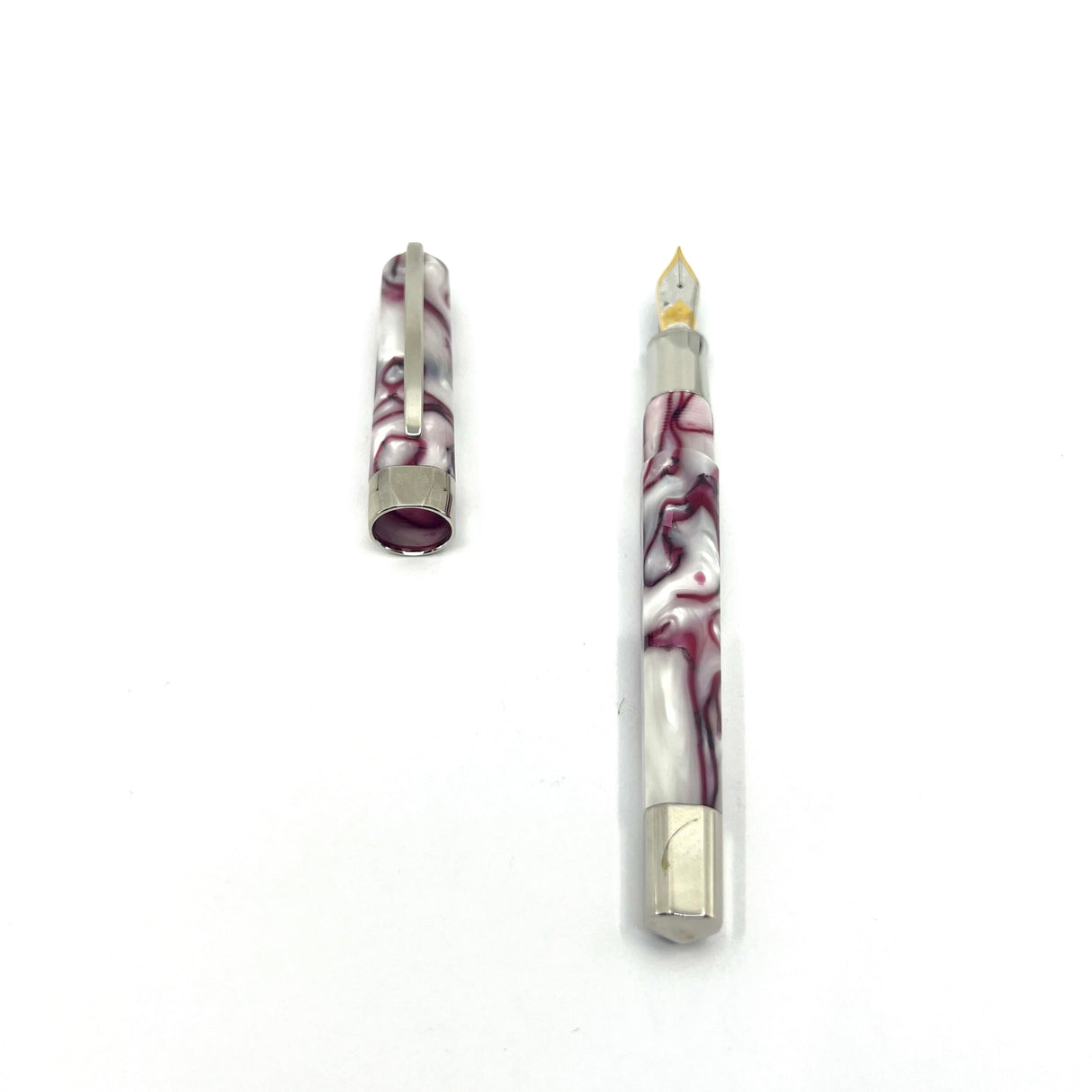 Visconti Opera Fountain Pen with Burgundy Streaking on Lustrous White Backdrop - Medium 14kt Gold Nib