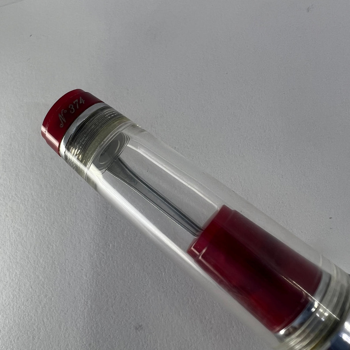 Aurora Optima Transparent Demonstrator Limited Edition Rollerball with Red Auroroloid Highlights