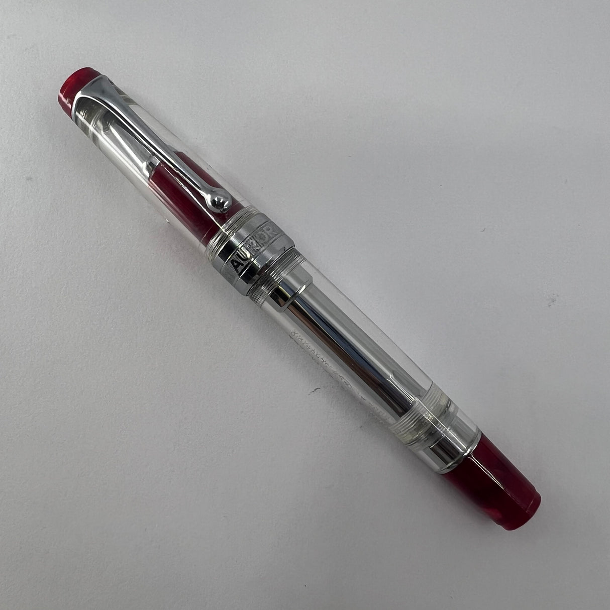 Aurora Optima Transparent Demonstrator Limited Edition Rollerball with Red Auroroloid Highlights