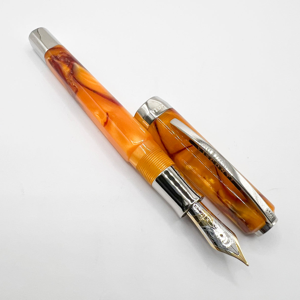 Visconti Opera Fountain Pen with Burgundy Streaking on Amber Backdrop - Medium 14kt Gold Nib
