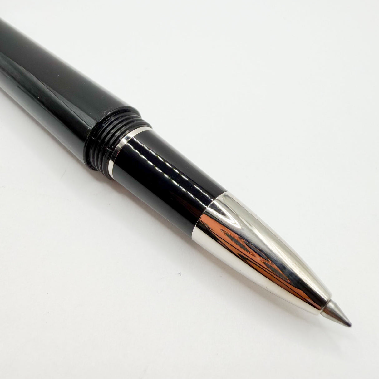 Cartier Santos-Dumont Black Composite Rollerball featuring a Distinctive Palladium-Finish Screwed Bezel Design
