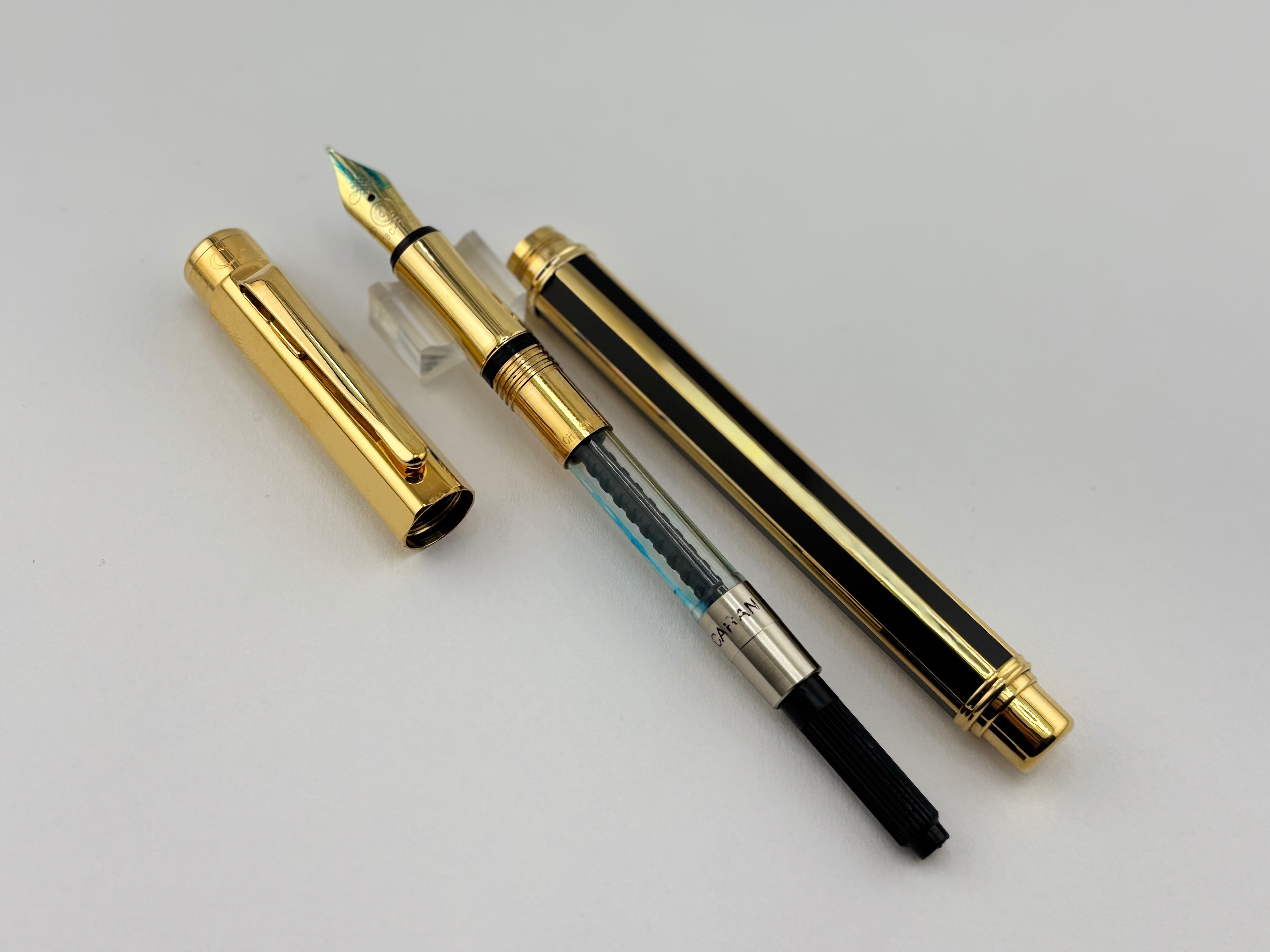 Caran D'ache Varius "Laque de Chine" Black and Gold Facetted Fountain Pen - Medium 18kt Gold Nib