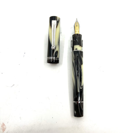 Delta "The Journal" Fountain Pen -Ivory Backdrop with Black/Brown Swirls