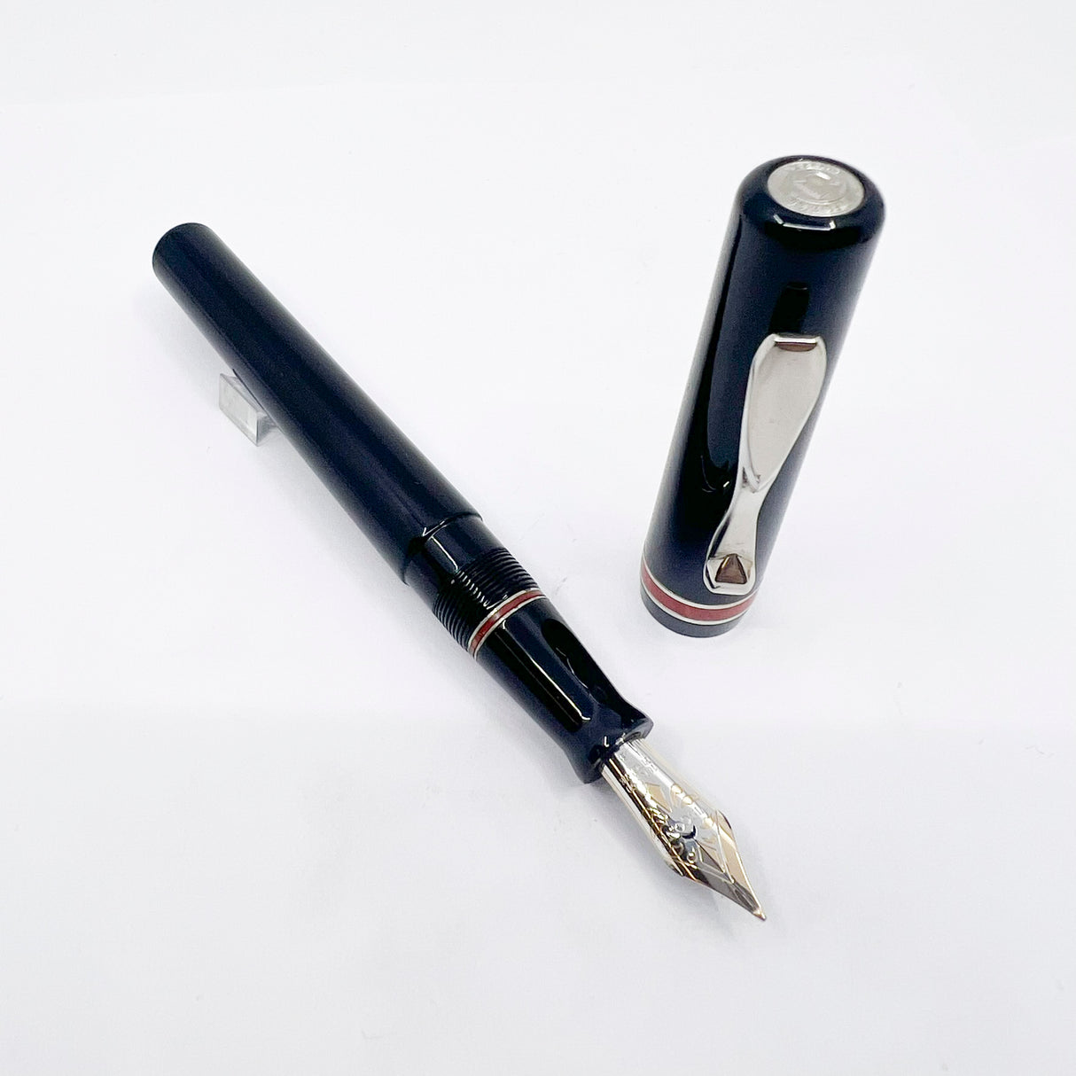 Visconti Glossy Black Resin Midnight Voyager Fountain  Pen - Two Rings of Coral Celluloid - Broad 18kt Gold Nib