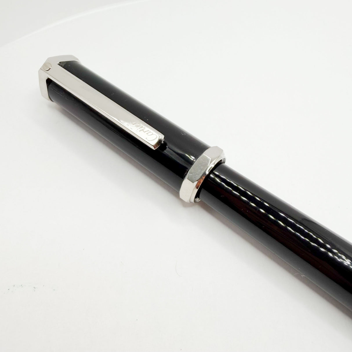 Cartier Santos-Dumont Black Composite Rollerball featuring a Distinctive Palladium-Finish Screwed Bezel Design